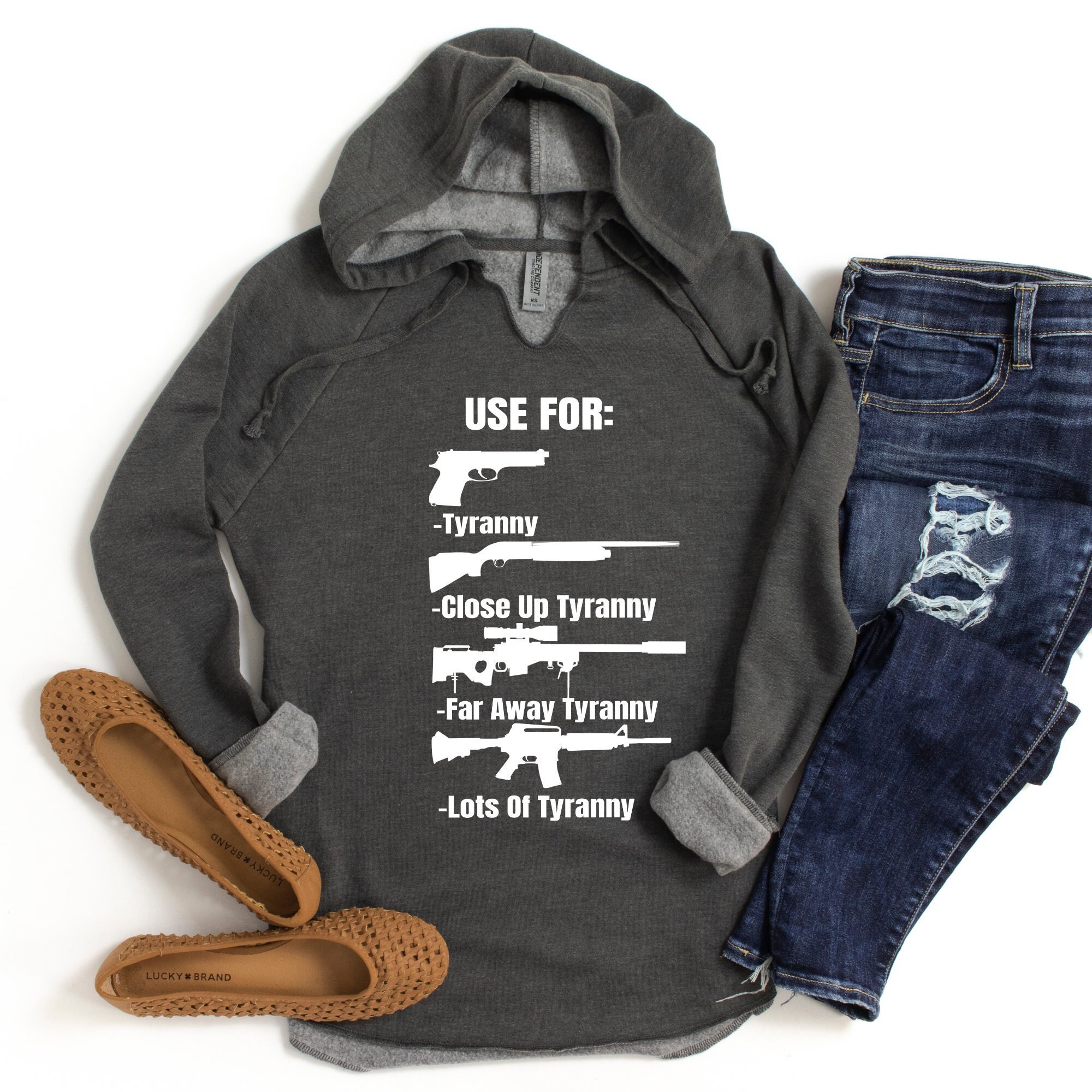 2A Hoodies Man wearing a 2A hoodie with Second Amendment slogan outdoors"
