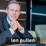 Len Pullen standing confidently in front of a corporate office, symbolizing innovation and leadership in business.