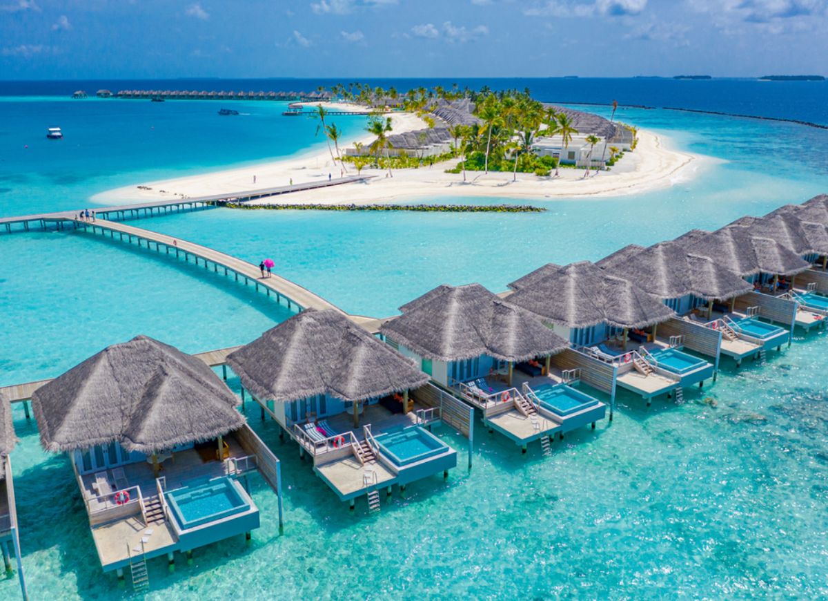 Luxury Escapes overwater villa package in the Maldives with private deck and ocean views