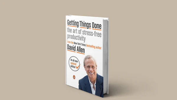 GTD Book cover by David Allen placed on a desk with productivity tools