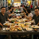 Chinatown hawker leftovers consumption shown through empty trays and uneaten food left on tables after closing.