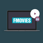 fmovies.wtf homepage interface displayed on laptop with caution icon.