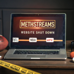 Laptop showing MethStreams shutdown warning with sports equipment and legal danger symbols in the background.
