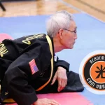 Students practicing Choi Kwang Do martial art techniques in a training hall